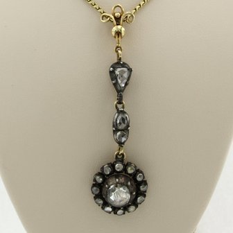 14k gold necklace with a gold and silver pendant set with rose cut diamonds