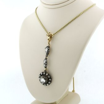 14k gold necklace with a gold and silver pendant set with rose cut diamonds