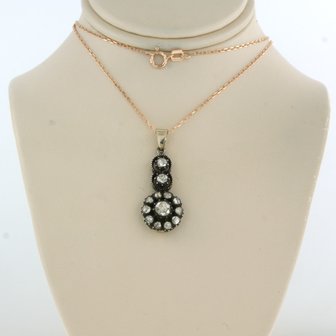 14k gold necklace with gold and silver pendant set with rose diamonds