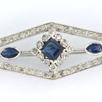 14K white gold brooch set with sapphire and single cut diamond