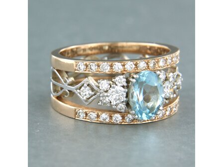 14k bicolour gouden band ring met centraal topaz en briljant geslepen diamant 0.75ct