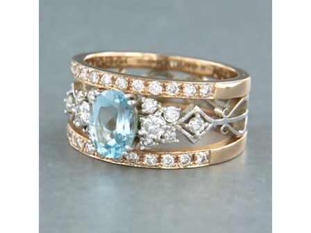 14k bicolour gouden band ring met centraal topaz en briljant geslepen diamant 0.75ct