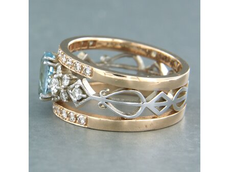 14k bicolour gouden band ring met centraal topaz en briljant geslepen diamant 0.75ct