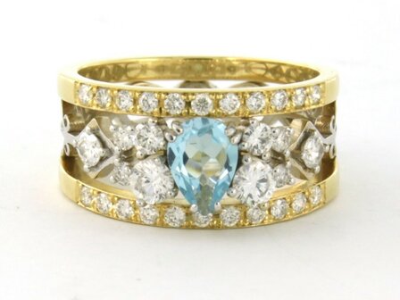 18k bicolour gouden band ring met centraal topaz en briljant geslepen diamant 0.92ct