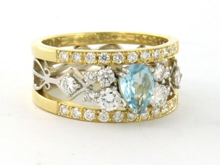 18k bicolour gouden band ring met centraal topaz en briljant geslepen diamant 0.92ct
