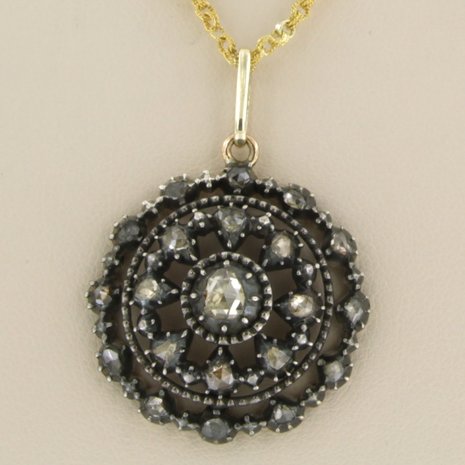 14 kt gold necklace with a gold/silver entourage pendant set with rose diamonds