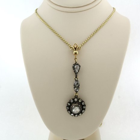 14k gold necklace with a gold and silver pendant set with rose cut diamonds