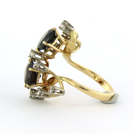 14k bicolour gouden ring bezet met granaat tot. 4,56ct en briljant geslepen diamanten tot. 0,36ct
