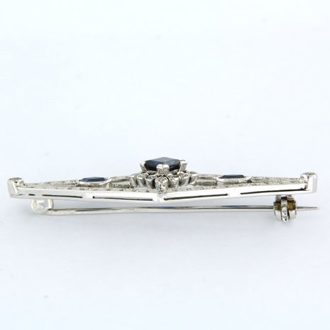 14K white gold brooch set with sapphire and single cut diamond