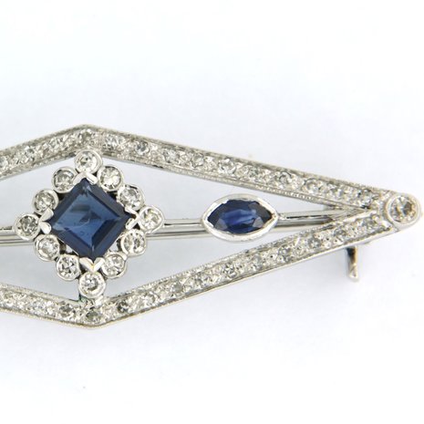 14K white gold brooch set with sapphire and single cut diamond