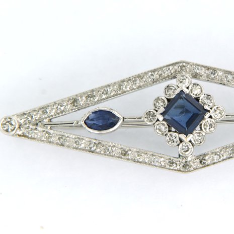 14K white gold brooch set with sapphire and single cut diamond