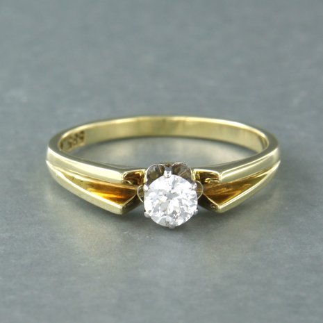 14 carat bicolor solitaire ring set with an old European cut diamond. 0.50ct 