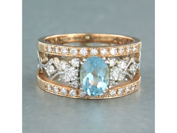 14 kt bicolour gold ring with central topaz and brilliant cut diamond 0.75 ct
