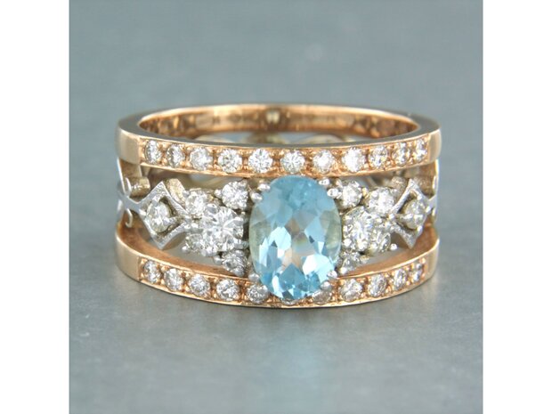 14k bicolour gouden band ring met centraal topaz en briljant geslepen diamant 0.75ct